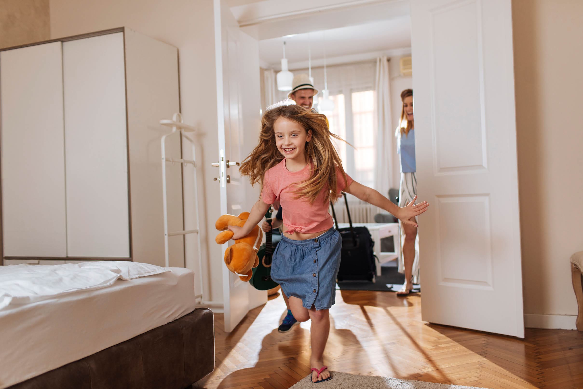 Shot of a happy family entering their accomodation