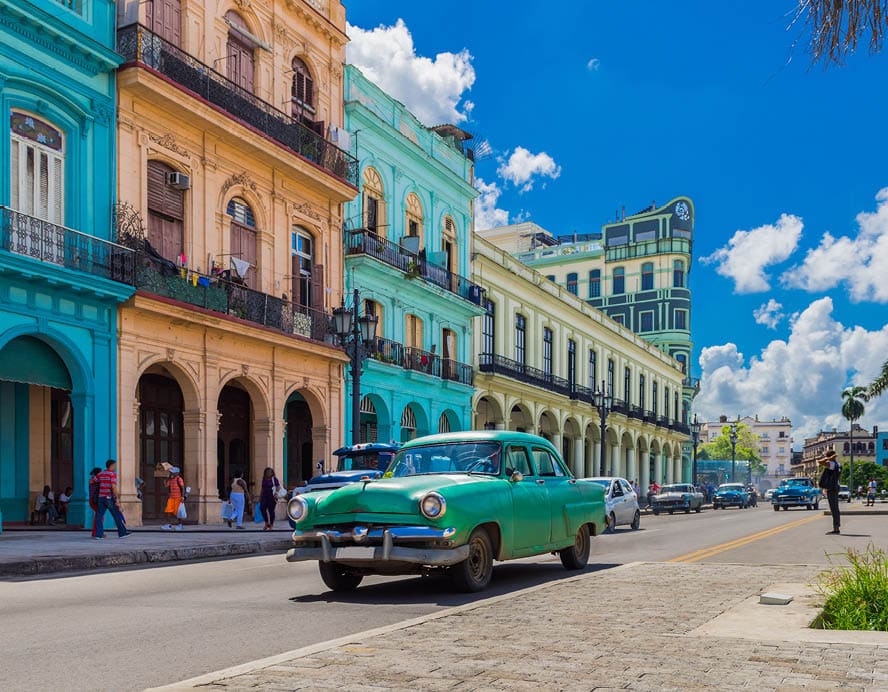 Cityscape with american green vintage car on the main street in Havana City Cuba - Serie Cuba Reportage